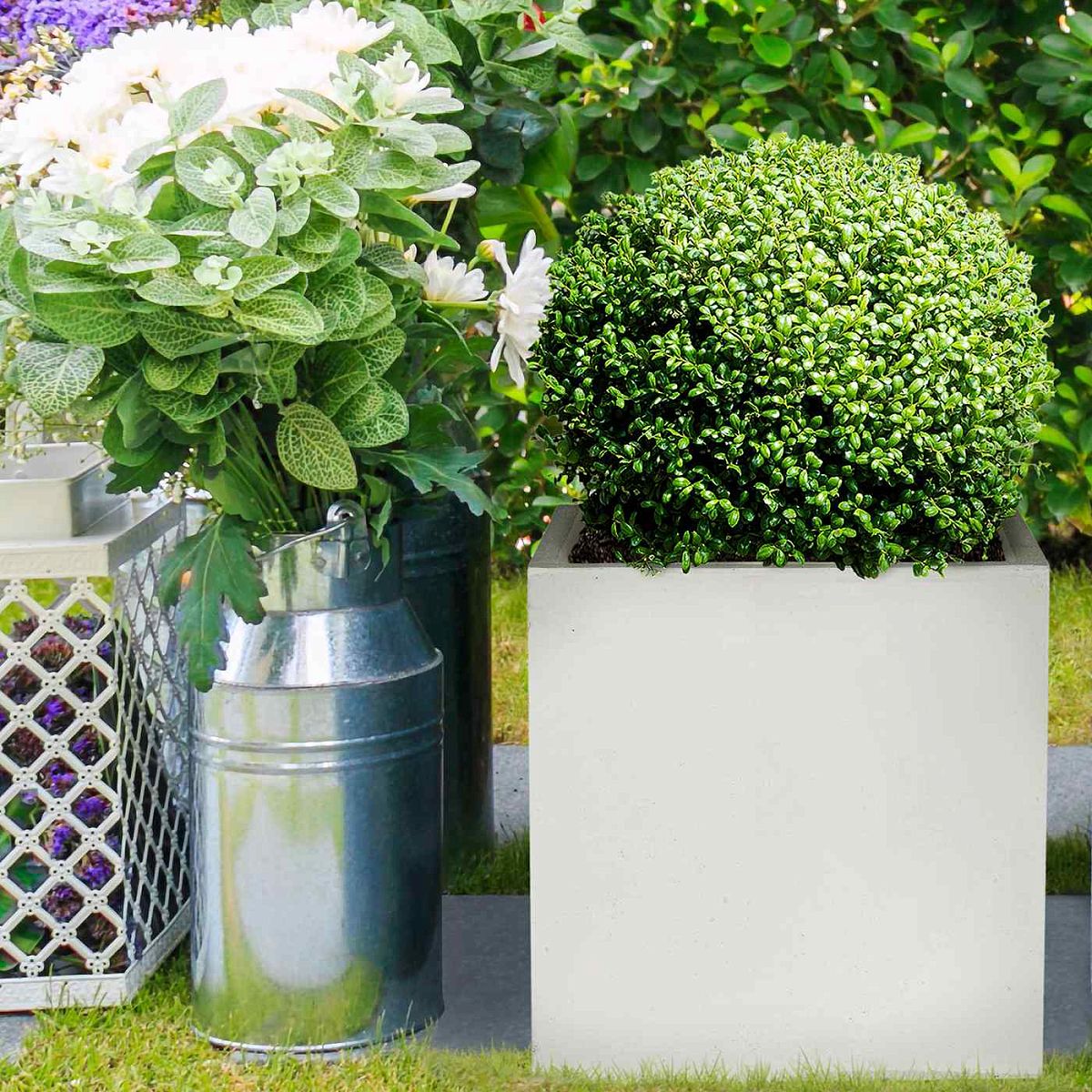 The IDEALIST Lite Contemporary Flower Box Square Garden Planter (H40 L40 W40 cm, 65L) adds charm to any space. Its stylish faux lead concrete design ensures healthy plants—just check for drainage holes for thriving greenery.