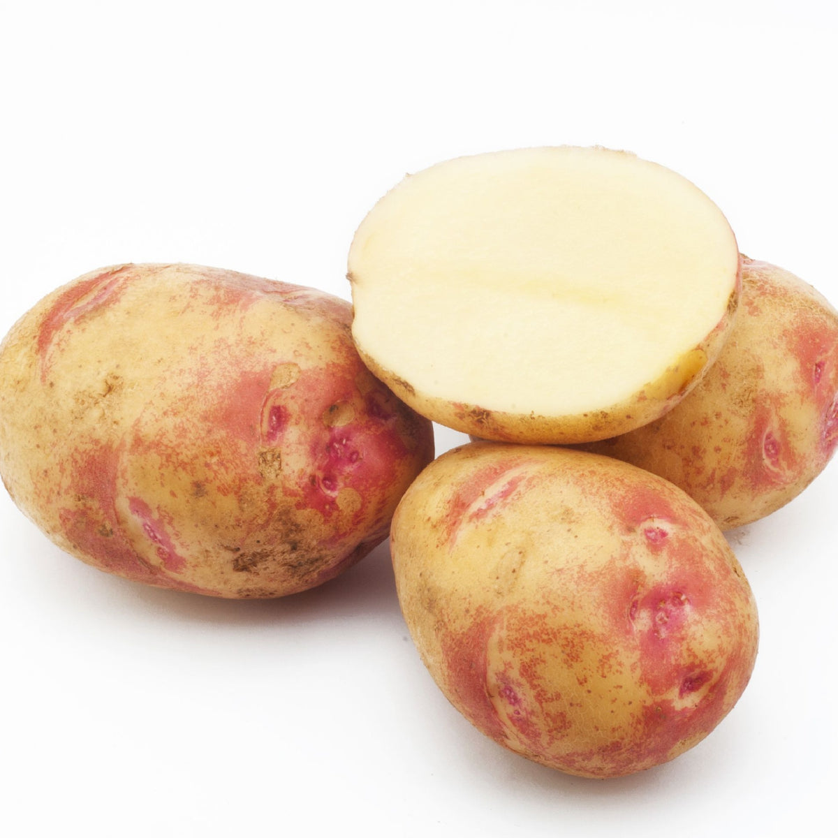 Picasso Seed Potatoes 2KG are shown on a white background, with three red-skinned potatoes and one cut to reveal smooth, light yellow flesh—perfect for gardeners seeking high-yield seed potatoes.