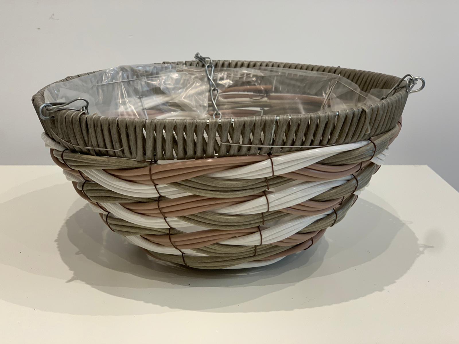 The Premium Hanging Basket, featuring beige, white, and pink woven bands and a clear plastic liner, measures 30cm wide with metal hooks on the rim. It is displayed on a white surface against a plain background.
